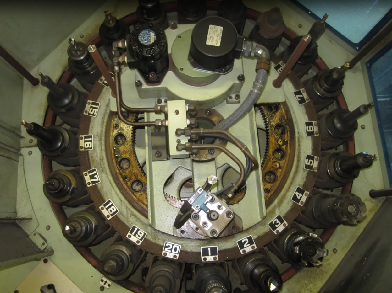 Tool turret with cover removed showing hydraulic actuators & encoders