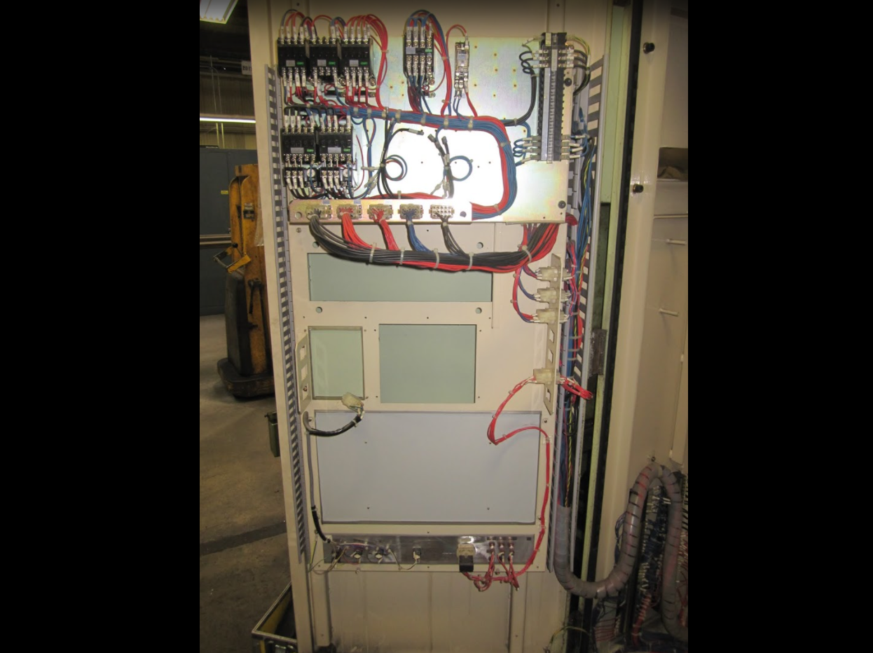 CNC control cabinet door stripped of old components